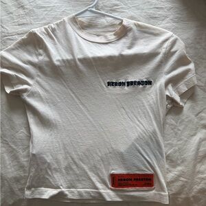 Heron Preston White Tee with Black Script and Orange Patch